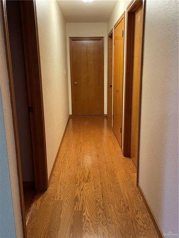 hallway featuring light hardwood / wood-style flooring