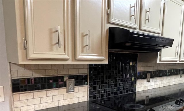 kitchen featuring black electric cooktop and backsplash