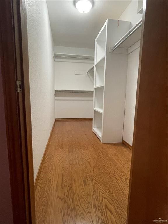 walk in closet featuring light wood-type flooring