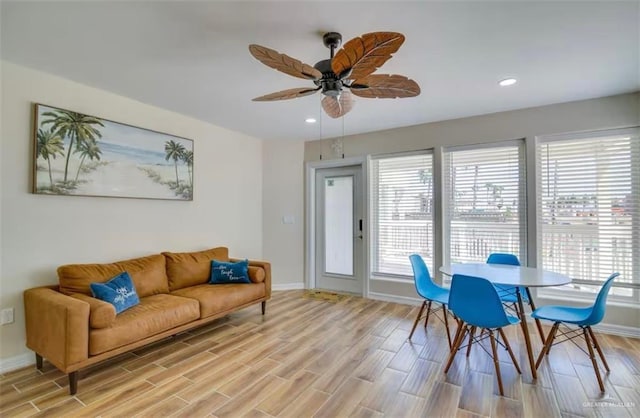 dining room featuring recessed lighting, ceiling fan, light wood-type flooring, and baseboards