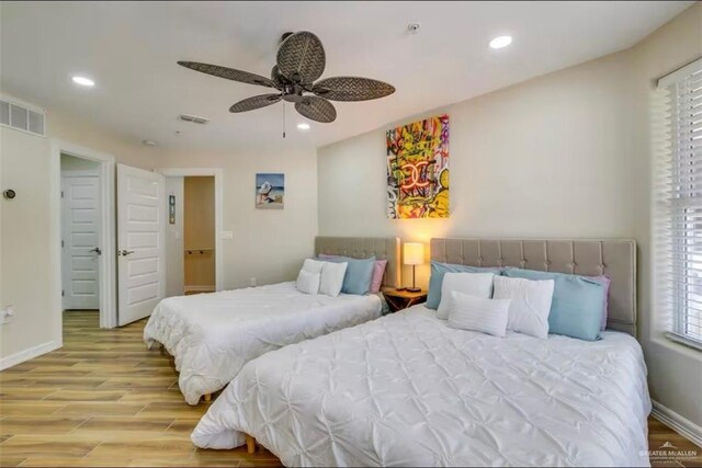 200 Padre Blvd Unit 2102, South Padre Island, TX 78597 - bedroom with recessed lighting, visible vents, baseboards, and wood finished floors