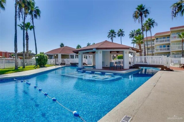 200 Padre Blvd Unit 2102, South Padre Island, TX 78597 - pool featuring a gazebo, an outdoor structure, a patio, and fence
