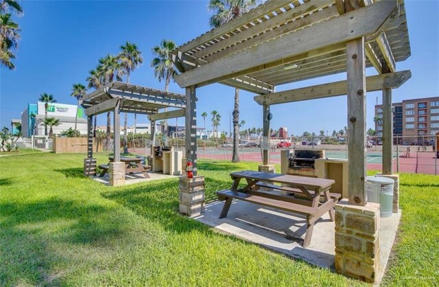200 Padre Blvd Unit 2102, South Padre Island, TX 78597 - surrounding community with a yard, fence, and a pergola