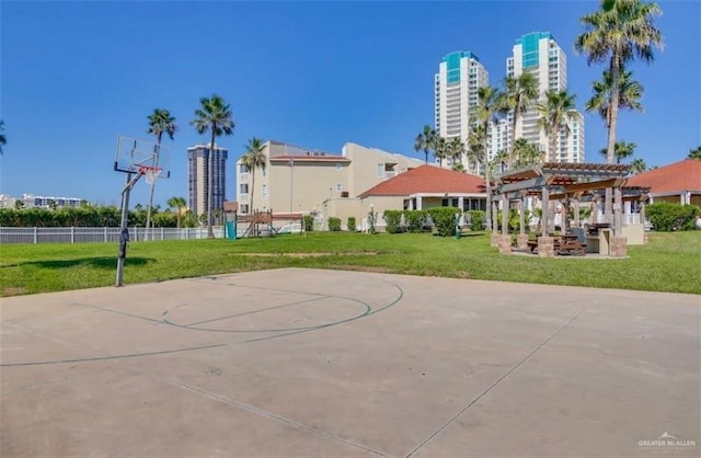 200 Padre Blvd Unit 2102, South Padre Island, TX 78597 - view of basketball court with a view of city, a lawn, a pergola, and community basketball court