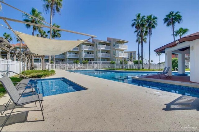 200 Padre Blvd Unit 2102, South Padre Island, TX 78597 - community pool with a patio area and fence
