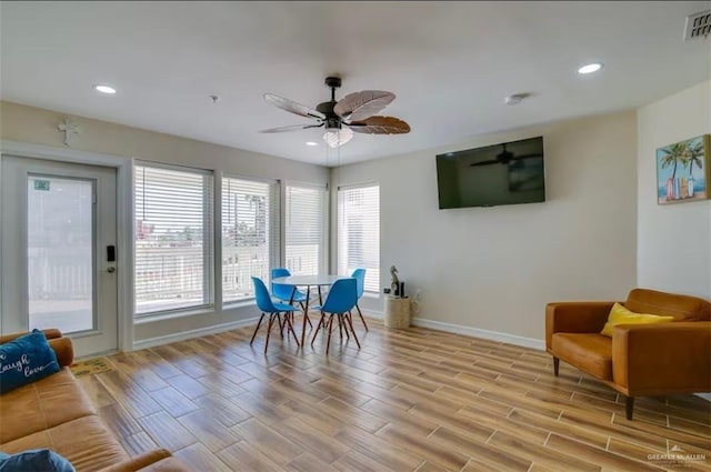 dining area with light wood finished floors, visible vents, baseboards, recessed lighting, and a ceiling fan