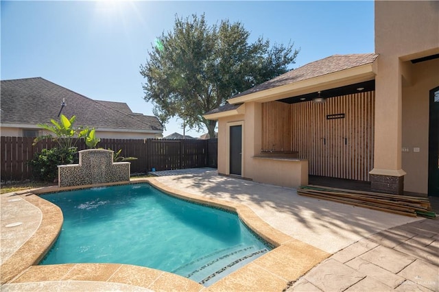 view of swimming pool featuring a patio area