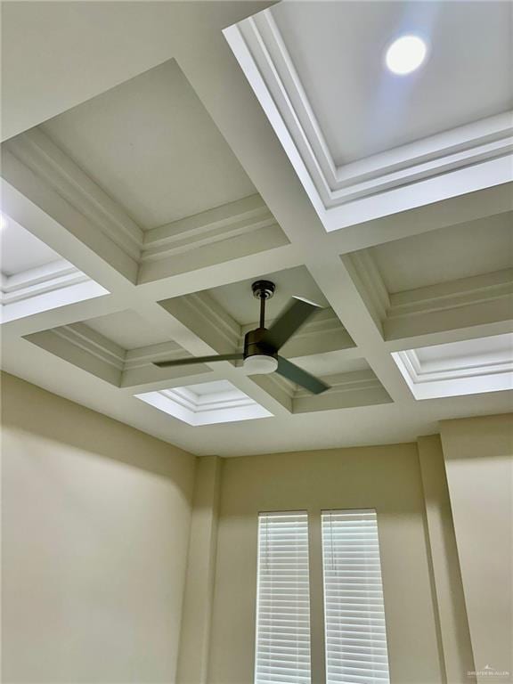 details with ceiling fan, beamed ceiling, and coffered ceiling