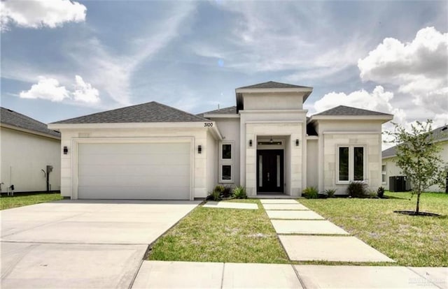 prairie-style house with a front yard and a garage