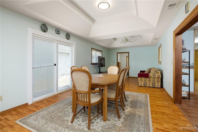 501 Capricorn St, Mission, TX 78572 - dining room featuring ceiling fan, visible vents, light wood-type flooring, and a raised ceiling
