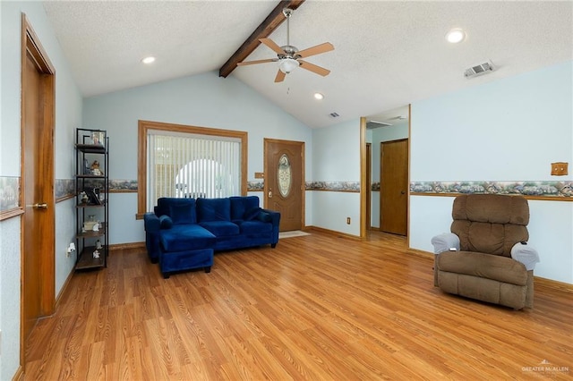 501 Capricorn St, Mission, TX 78572 - living room featuring vaulted ceiling with beams, ceiling fan, light wood finished floors, baseboards, and visible vents