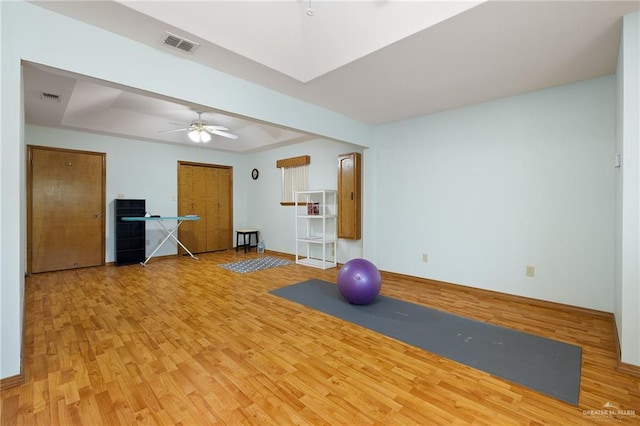 501 Capricorn St, Mission, TX 78572 - workout room featuring a raised ceiling, wood finished floors, visible vents, and a ceiling fan