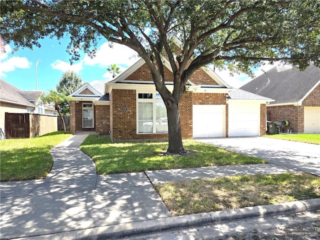 view of front of property with a front lawn and a garage