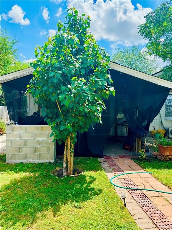 view of yard with a sunroom