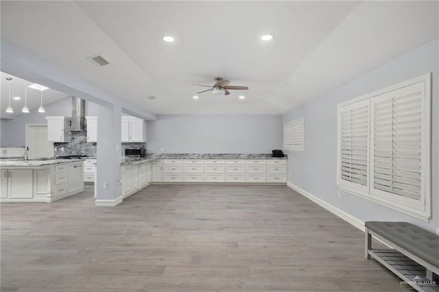 106 E Ithaca Ave, Mcallen, TX 78501 - unfurnished living room with a ceiling fan, light wood-type flooring, recessed lighting, and baseboards