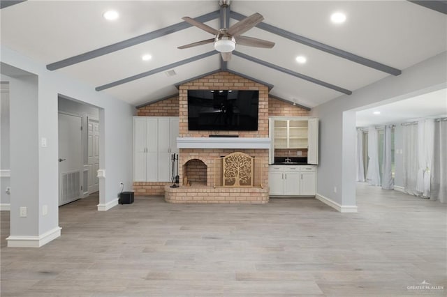 106 E Ithaca Ave, Mcallen, TX 78501 - unfurnished living room with ceiling fan, light wood-style flooring, baseboards, recessed lighting, and a sink
