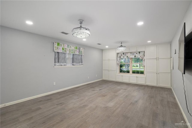 106 E Ithaca Ave, Mcallen, TX 78501 - empty room with recessed lighting, wood finished floors, and baseboards