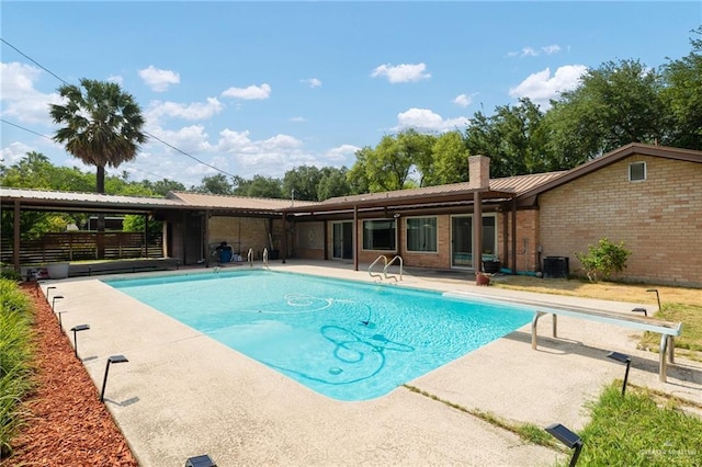 106 E Ithaca Ave, Mcallen, TX 78501 - swimming pool with a patio area, a diving board, and cooling unit