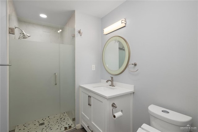 106 E Ithaca Ave, Mcallen, TX 78501 - bathroom featuring toilet, a shower stall, vanity, and recessed lighting