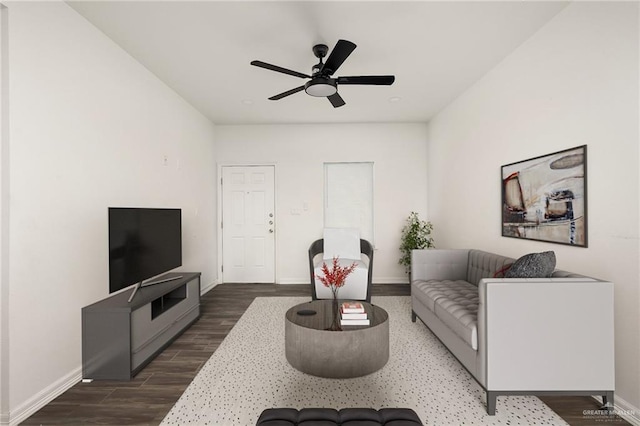 living room with ceiling fan and dark hardwood / wood-style floors