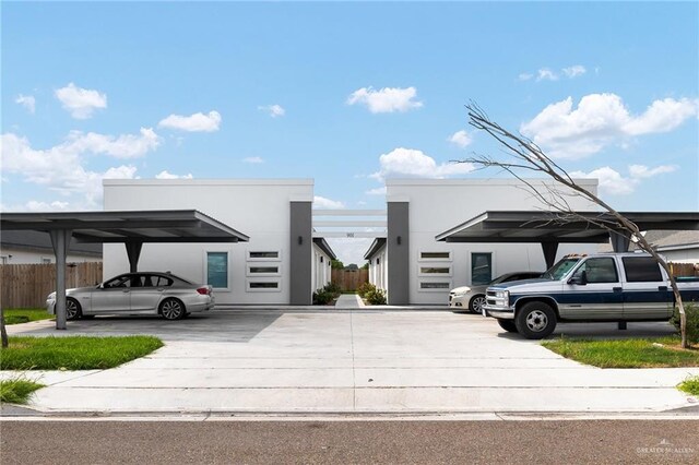 view of vehicle parking featuring a carport