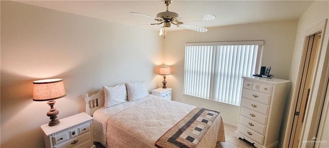 bedroom featuring multiple windows and a ceiling fan