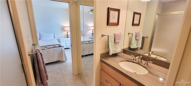 ensuite bathroom featuring ensuite bath, vanity, and tile patterned floors