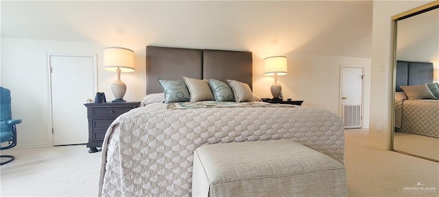 bedroom featuring light carpet and visible vents