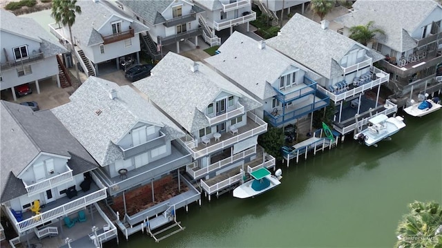 aerial view featuring a residential view and a water view