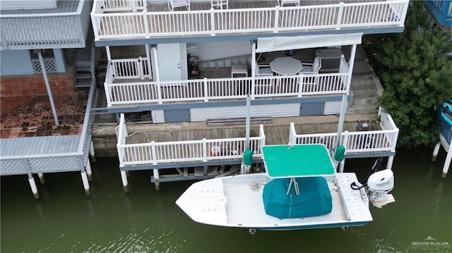 rear view of property with a water view