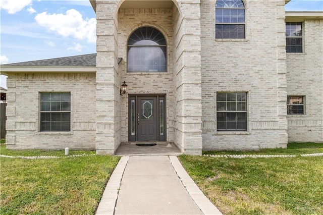 1711 Solar Dr, Mission, TX 78574 - entrance to property featuring a lawn