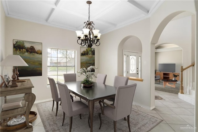 1711 Solar Dr, Mission, TX 78574 - dining room with light tile patterned floors, arched walkways, a chandelier, coffered ceiling, and baseboards