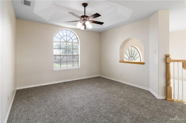 1711 Solar Dr, Mission, TX 78574 - carpeted spare room featuring a tray ceiling, ceiling fan, and baseboards