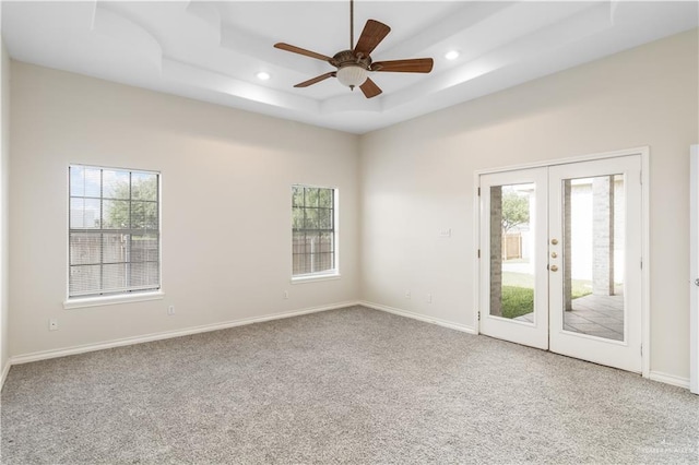 1711 Solar Dr, Mission, TX 78574 - carpeted empty room featuring plenty of natural light, french doors, a raised ceiling, recessed lighting, and ceiling fan