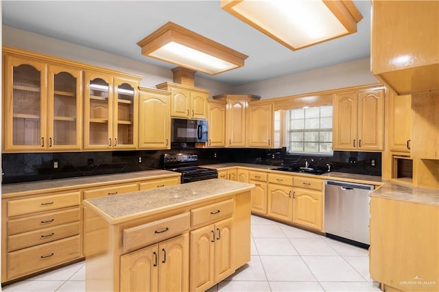 1711 Solar Dr, Mission, TX 78574 - kitchen featuring black appliances, light brown cabinetry, light tile patterned flooring, and decorative backsplash