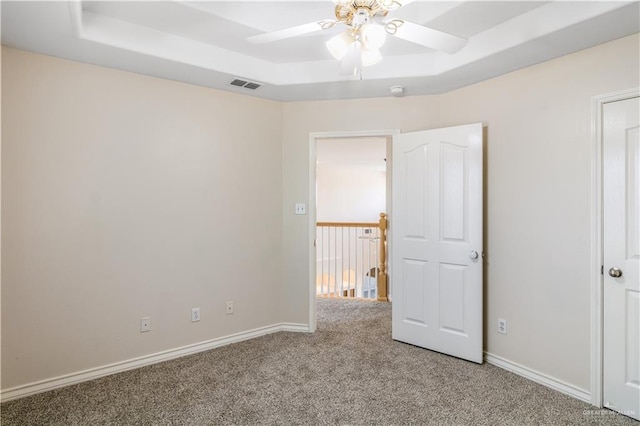 1711 Solar Dr, Mission, TX 78574 - unfurnished bedroom with carpet floors, baseboards, and a raised ceiling