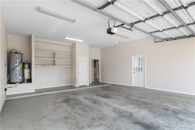 1711 Solar Dr, Mission, TX 78574 - garage with water heater, a garage door opener, and baseboards