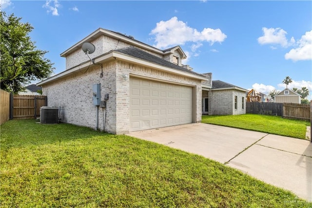 1711 Solar Dr, Mission, TX 78574 - view of property exterior featuring brick siding, cooling unit, an attached garage, and driveway