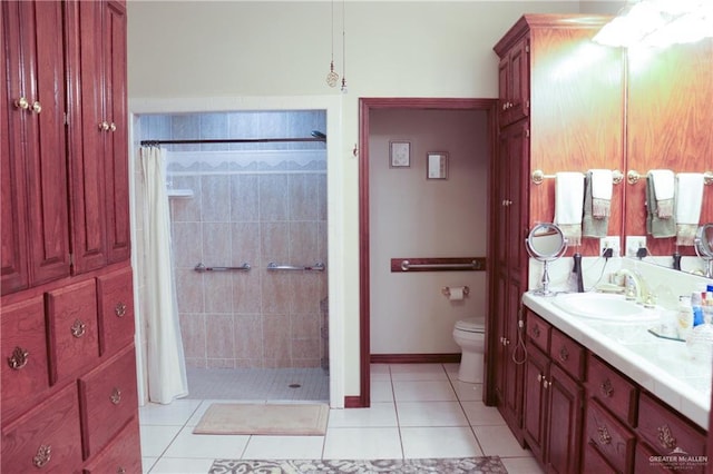 bathroom featuring tile patterned flooring, vanity, a shower with shower curtain, and toilet