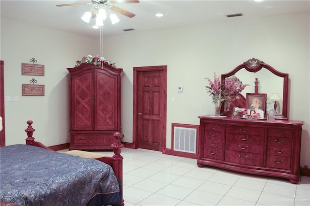 tiled bedroom featuring ceiling fan