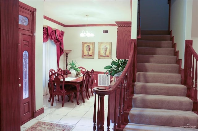 interior space with ornamental molding, tile patterned floors, and a notable chandelier