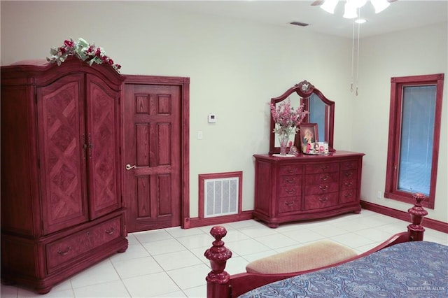 bedroom with light tile patterned flooring and ceiling fan