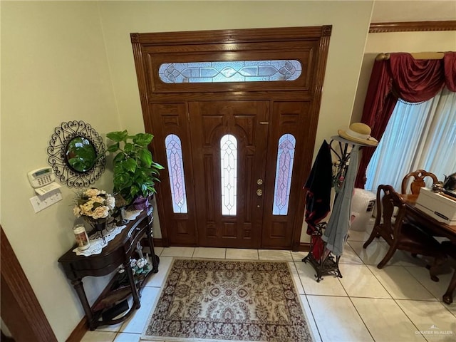 foyer entrance with light tile patterned flooring