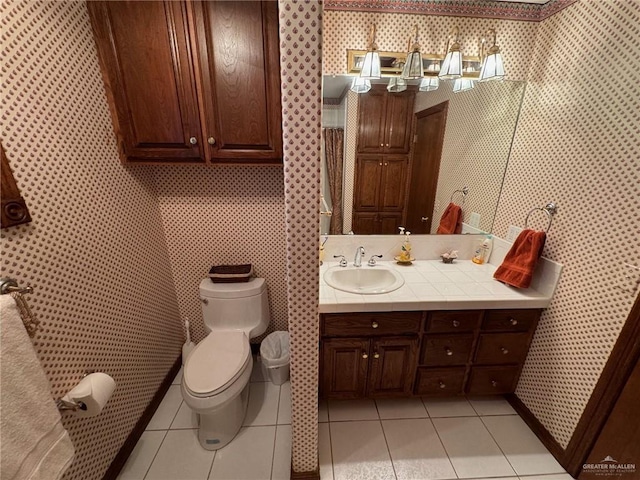 bathroom with tile patterned floors, toilet, and vanity