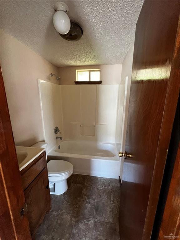 full bathroom with vanity, toilet, shower / tub combination, and a textured ceiling