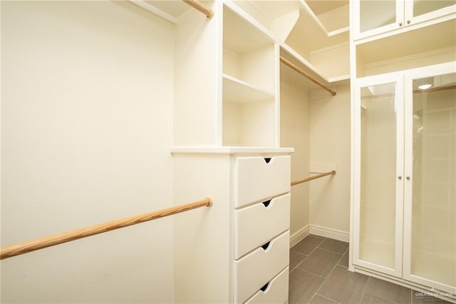 5501 N 8th St, Mcallen, TX 78504 - spacious closet featuring dark tile patterned flooring