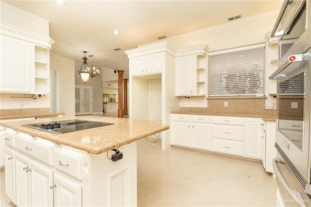 5501 N 8th St, Mcallen, TX 78504 - kitchen featuring open shelves, black electric stovetop, visible vents, and a notable chandelier