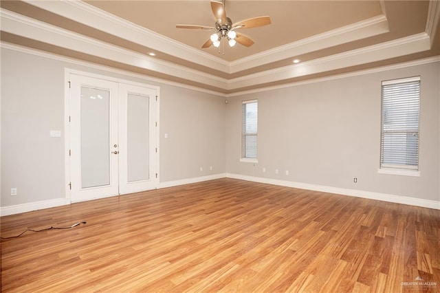 5501 N 8th St, Mcallen, TX 78504 - spare room featuring light wood finished floors, a ceiling fan, ornamental molding, and a raised ceiling