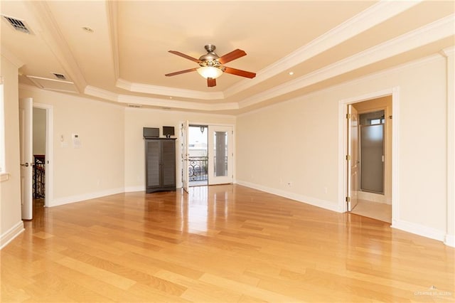5501 N 8th St, Mcallen, TX 78504 - empty room with light wood-style flooring, a tray ceiling, visible vents, a ceiling fan, and ornamental molding