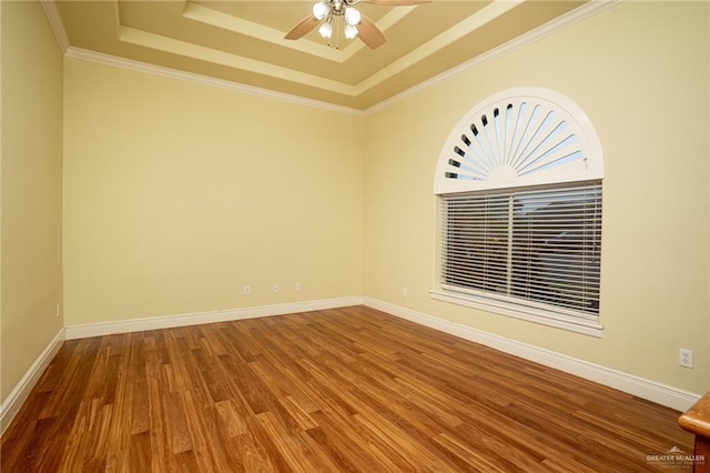 5501 N 8th St, Mcallen, TX 78504 - empty room with crown molding, a ceiling fan, wood finished floors, and a raised ceiling